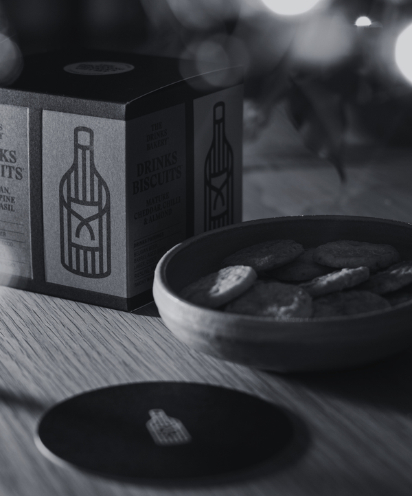 Treat the discerning drinker in your life to all four of our signature Drinks Biscuits, as well as two coasters to share a tipple with them.