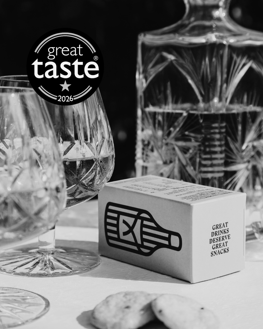 Winner of a Great Taste Star 2026. The Drinks Bakery Drinks Biscuits - Mature Cheddar Cheese & Smoked Chilli are described as having a: 