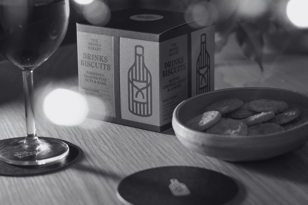 Treat the discerning drinker in your life to all four of our signature Drinks Biscuits, as well as two coasters to share a tipple with them.