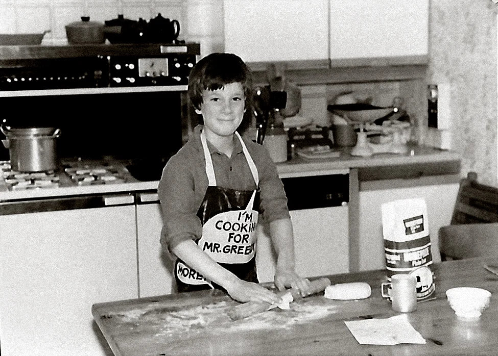 Young Andy sporting a less 'streamline' haircut and baking.
